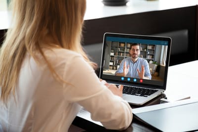 Manager Employee Virtual Meeting Shutterstock _1678229824